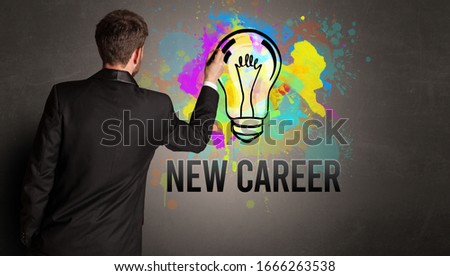 businessman drawing colorful light bulb with NEW CAREER inscription on textured concrete wall, new business idea concept