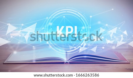 Open book with KPI abbreviation, modern technology concept