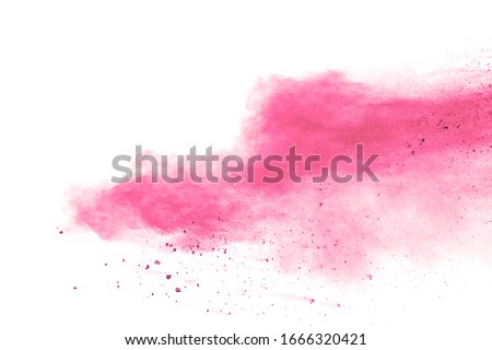 Pink powder explosion on white background.Pink dust splatter on background.