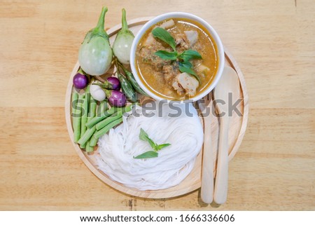 Thai rice noodle with chicken and minced fishes sauce calls “Ka-Nom-Jean-Nam-Ya-Pa”.