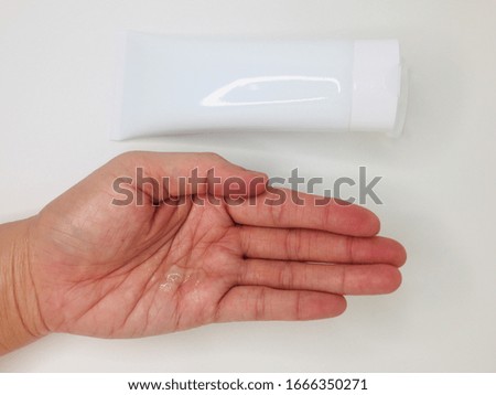 Hand of a woman applying alcohol hand gel against the virus and bacteria