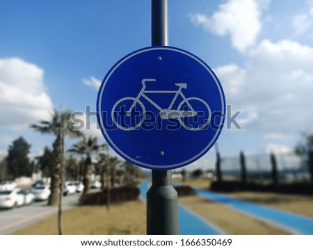Bikeway / cycling traffic sign / road sign. There is a blue bike road on the right.