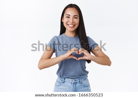Cheerful, friendly and enthusiastic charming asian girlfriend saying I love you, showing heart sign and smiling, confess admiration, cherish relationship, happy valentines day, make surpise