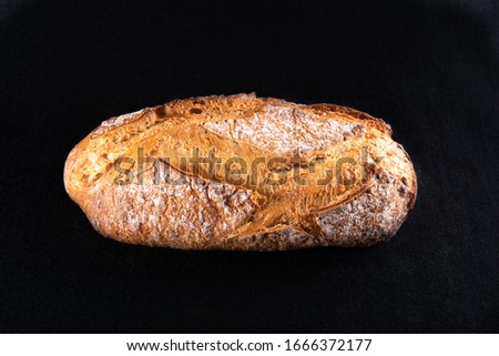 Rustic bread, beautiful golden crust with diamond patterns, close-up Royalty-Free Stock Photo #1666372177