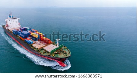 Aerial infront of cargo ship carrying container and running for export  goods  from  cargo yard port to custom ocean concept freight shipping by ship .