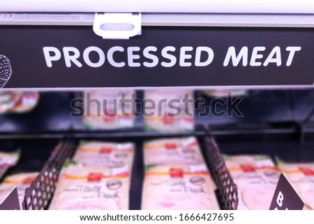 Processed Meat signage at the meat  section of supermarket with defocused background