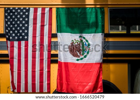 American and Mexican flag on a bus