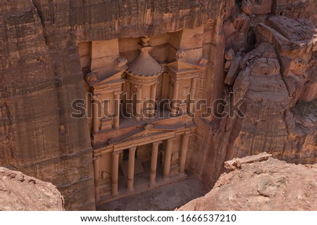 Al Khazneh, the Treasury in Petra with elegantly decorated in the Greek style. Building in rocks of pink sandstone. Petra, a historical and archaeological city in Jordan. Travel photo. Top view
