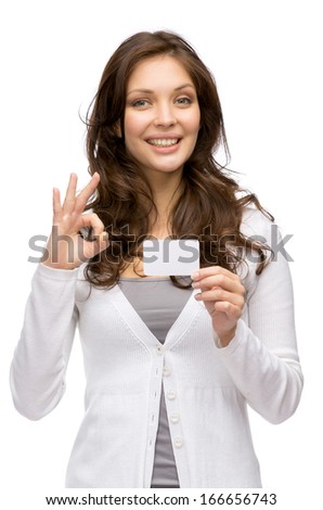 Half-length portrait of woman keeping business card and okay gesturing, isolated on white