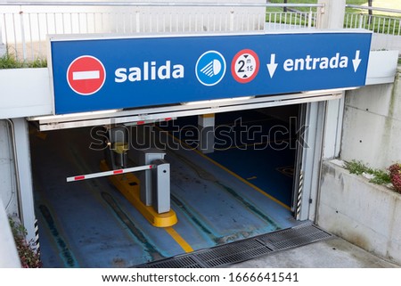 Salida, entrada sign at underground car park entrance. Exit, entry in spanish.