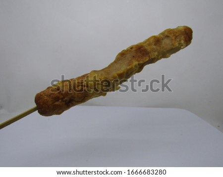 Sate sosis goreng or wooden stick skewers fried sausage chicken beef meat. Long then cut slices into four.Jajanan Anak sekolah murah. Snack at school with cheap price.