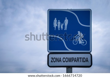 A shared zone sign indicating where pedestrians and bicycles share the area