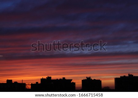 Beautiful sunset in Kansas City, Missouri. Sky brings out a lot of color and mixes different colors. Buildings in the bottom to add contrast and to complete the photo. This was taken by professionals.