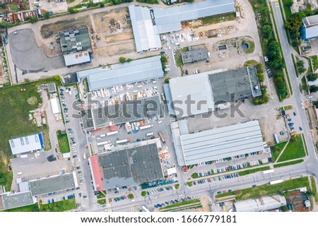 aerial top down view on roofs of industrial building. industrial zone on city suburb