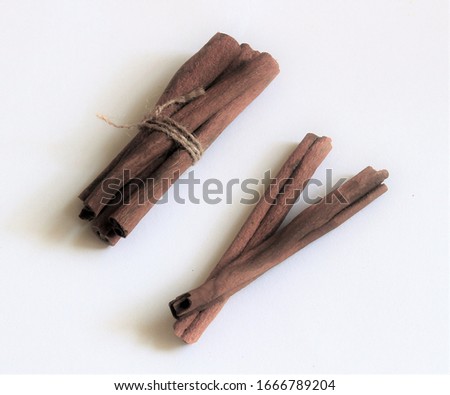 Briwn sticks of dry cinnamon on white background, healthy food picture