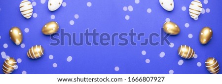 Happy Easter background. golden shine decorated eggs isolated on blue. For greeting card, promotion, poster, flyer, web-banner, article.