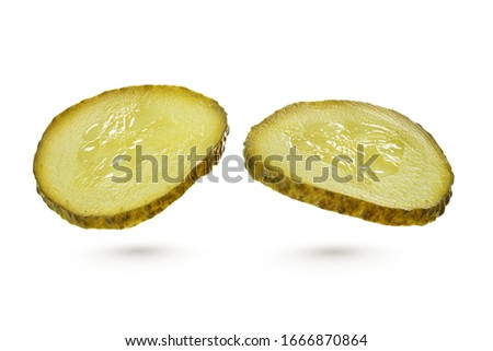 Two sliced green pickles isolated on white background with clipping path Royalty-Free Stock Photo #1666870864