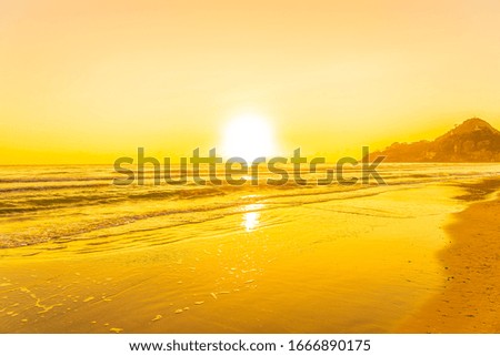 Beautiful tropical nature beach sea ocean with sunset or sunrise for travel vacation