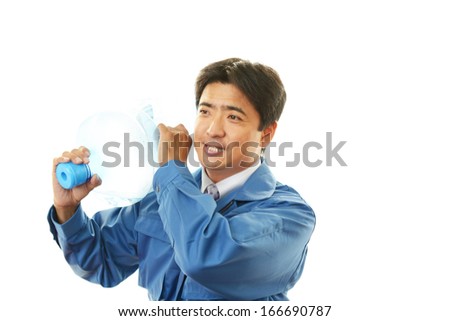 Worker with a container of water