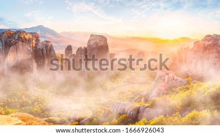 Landscape with Roussanou Monastery and rock formations at sunset, Meteora, Greece