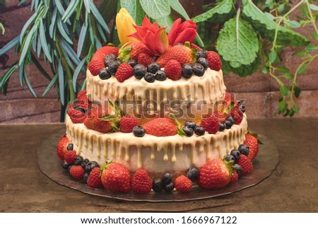 fresh fruit cake with strawberries and blueberries