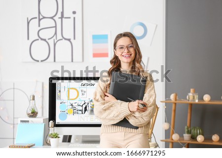 Portrait of female interior designer in office Royalty-Free Stock Photo #1666971295