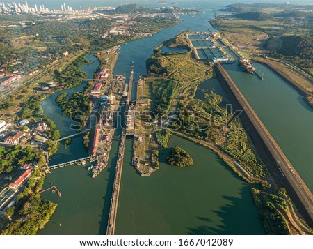 Beautiful aerial view of the Panama Channel Miraflores Locks at the Sunset Royalty-Free Stock Photo #1667042089