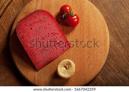 Expensive elite cheese on a wooden background