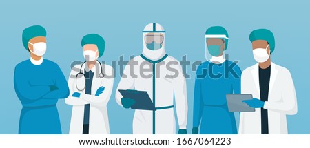 Professional doctors and nurses wearing protective suite and standing together to fight coronavirus Royalty-Free Stock Photo #1667064223