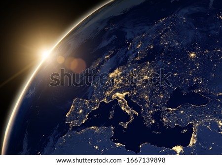 Middle East, Europe and sun in satellite picture, view of Earth at night from space. World map on dark globe at sunset. Aerial photo and planet theme. Elements of this image furnished by NASA.