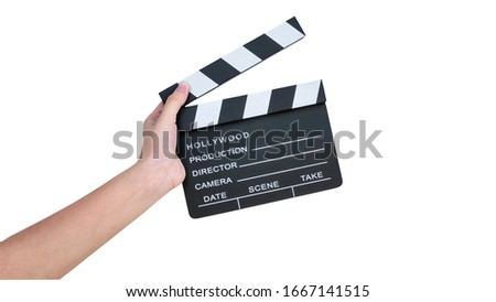 hand holding movie clapper board isolated on white background with clipping path, copy space for your advertisement or promotional text.