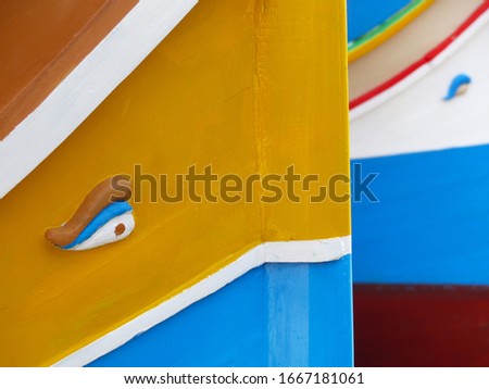 Details of the colourful traditional Maltese fishing boats, the luzzu. Marsaxlokk port, Malta