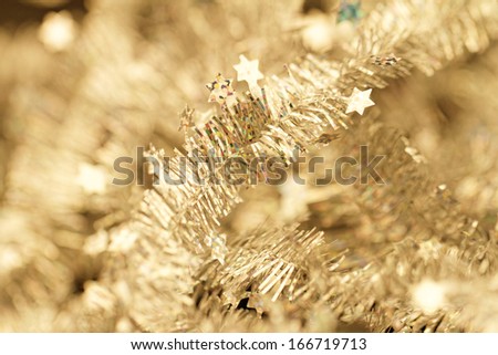 Yellow tinsel Christmas decoration - close-up photo