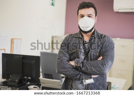 office clerk at work with medical mask for allergy or illness