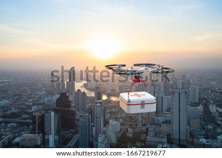 Drone flying across city with carrying first aid package to rescuers, Future technology 5G concept