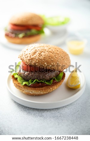 Traditional homemade burger with lettuce and tomato