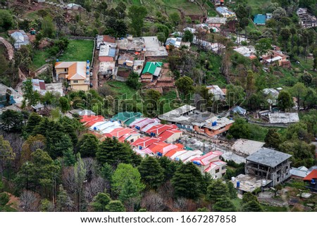 Houses in a Valley        Captured this picture in northern area of Pakistan.It shows how people lives in the areas where are mountains.