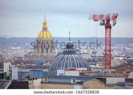 Cupola of Les Invalides and construction crane in Paris 
