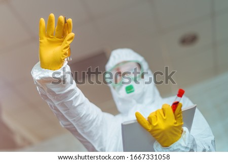 Female epidemiologist gesturing stop sign in hospital quarantine, selective focus