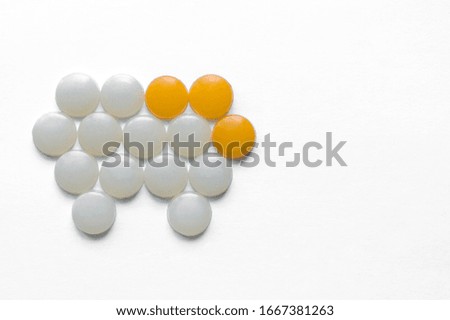 Pain in the teeth, toothache, difficult case. Caries. Round white and yellow details lie in the shape of a tooth, concept. Visit to the dentist. Light background. Place for text.