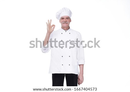 Elderly bearded professional chef senior man, posing with okay single, isolated over white background.