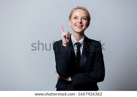 Smiling businesswoman in a classic black business suit