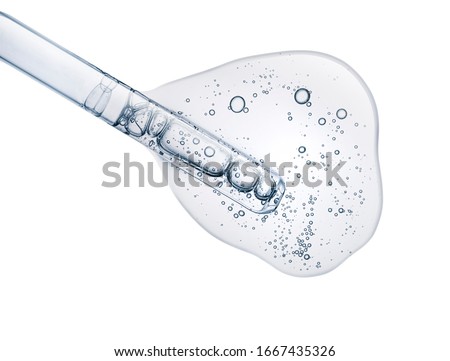 Liquid gray transparent gel or serum on white isolated background Royalty-Free Stock Photo #1667435326