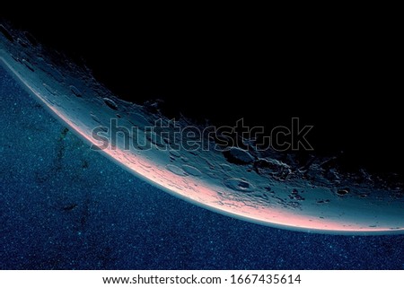 The moon is in a growing phase. On a dark background. Elements of this image were furnished by NASA.