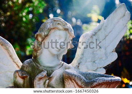 Death. Close up sad angel with urn with dust as symbol of pain, fear and end of life. Ancient statue.