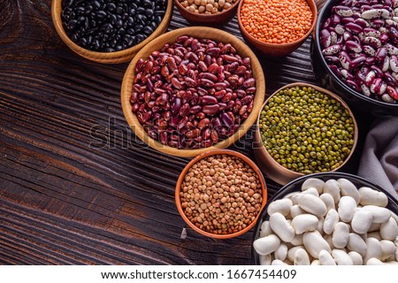 Fresh organic natural beans on wooden rustic background