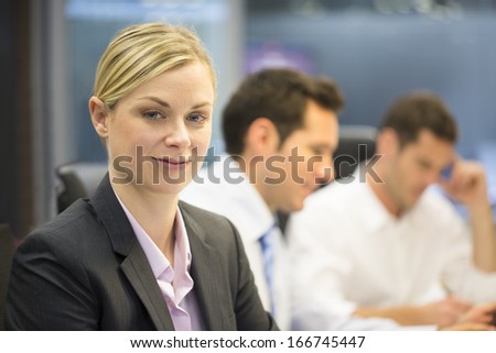 Portrait of smiling businesswoman in office, looking camera 