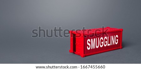 Red cargo shipping container with the word Smuggling. Traffic of prohibited goods and substances, bypassing customs control. Corruption, violation of the embargo, circumvention of sanctions. Import Royalty-Free Stock Photo #1667455660