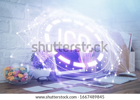 Multi exposure of blockchain and crypto economy theme hologram and table with computer background. Concept of bitcoin cryptocurrency.