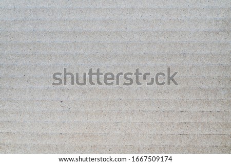 Gray background from sheet of recycled cardboard. Close-up detail macro photography view of abstract texture recycled eco-friendly carton material pattern background.